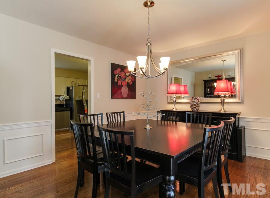 5305 Mapleridge Road Raleigh, NC 27609 - Photo 5 of 25 a view of a dining room and a table in a room