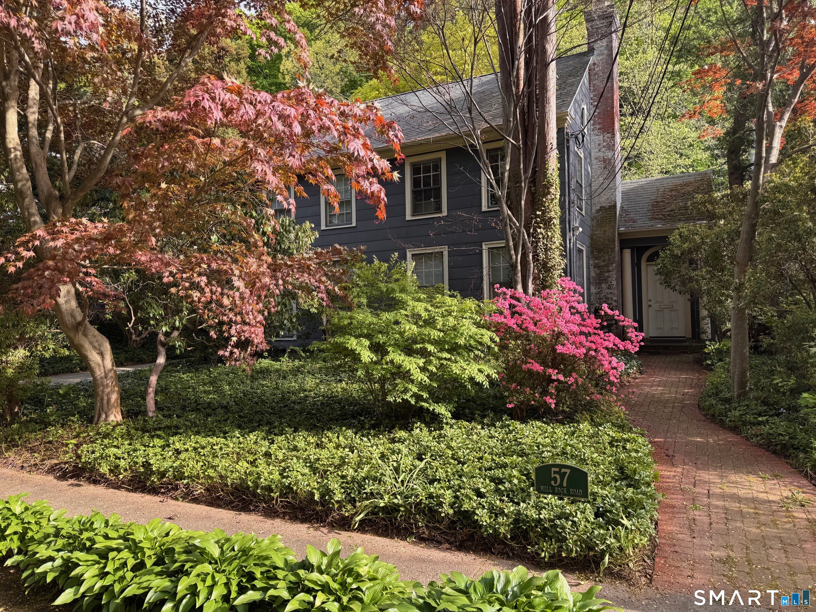 57 Mill Rock Road Hamden, CT 06517 - Photo 1 of 24 a front view of a house with a yard