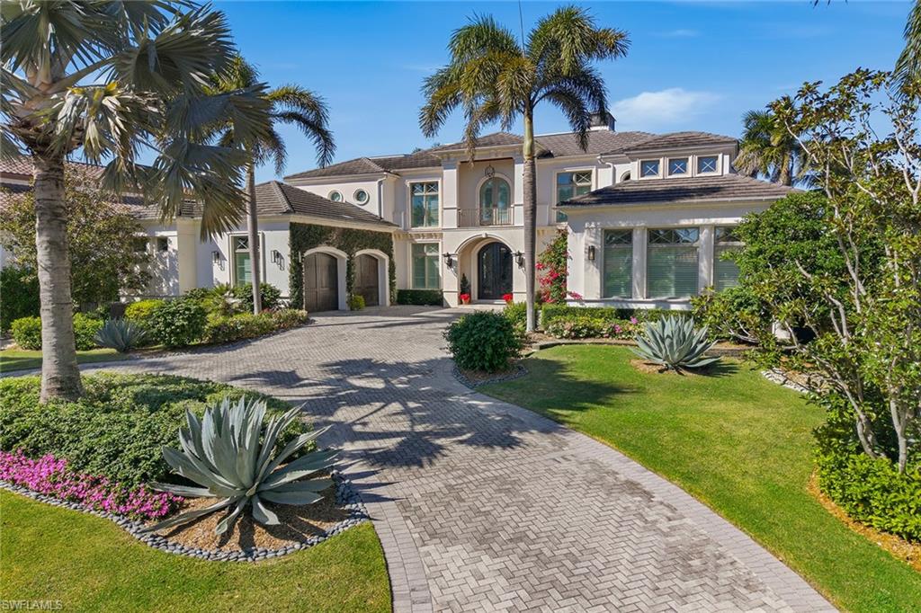 3125 Leeward Lane Naples, FL 34103 - Photo 11 of 30 front view of a house with a yard
