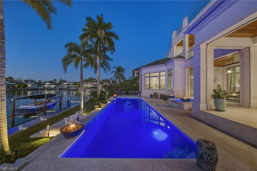 3125 Leeward Lane Naples, FL 34103 - Photo 14 of 30 a view of swimming pool with outdoor seating