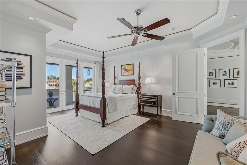 3125 Leeward Lane Naples, FL 34103 - Photo 23 of 30 a living room with furniture and a wooden floor