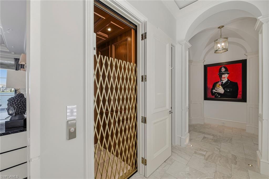 3125 Leeward Lane Naples, FL 34103 - Photo 26 of 30 a view of a hallway with interior of the house