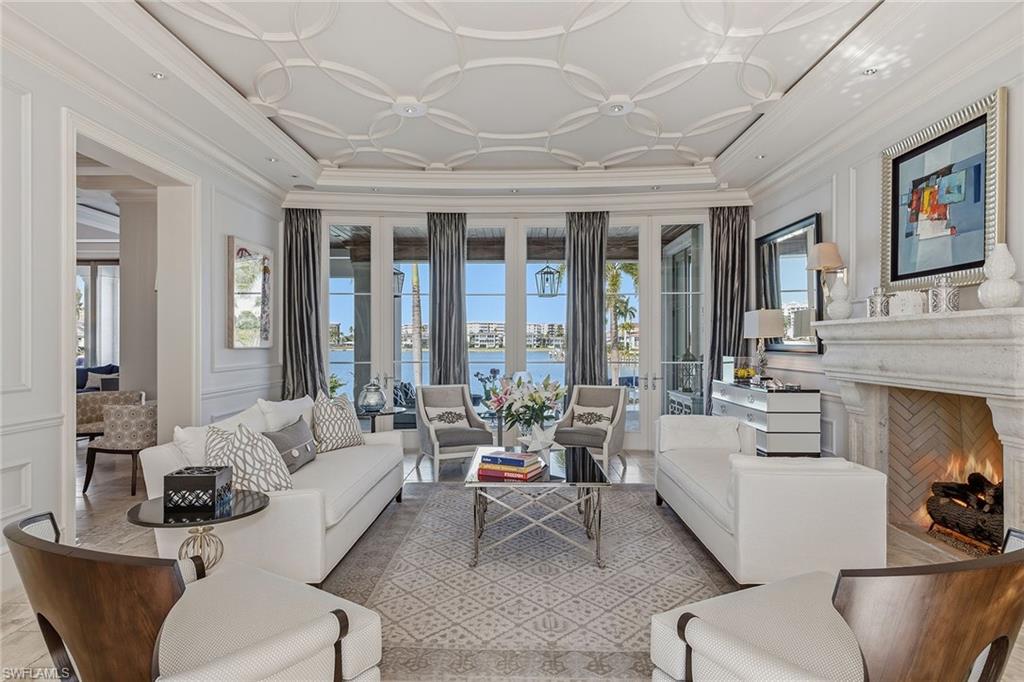 3125 Leeward Lane Naples, FL 34103 - Photo 4 of 30 a living room with furniture and a large window
