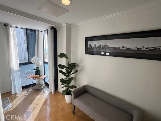 a dining room with furniture and wooden floor