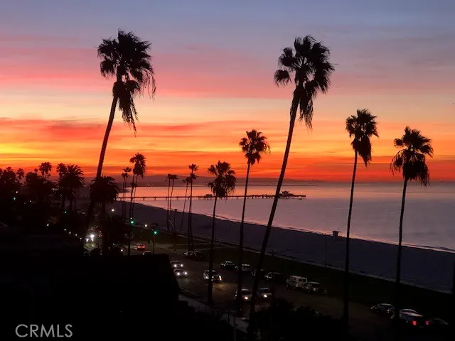 a bathroom with a granite countertop toilet sink and mirror