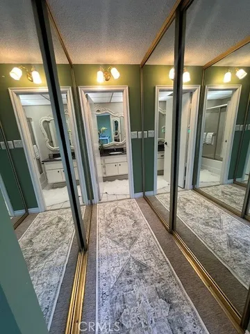 a bathroom with a granite countertop sink mirror and shower