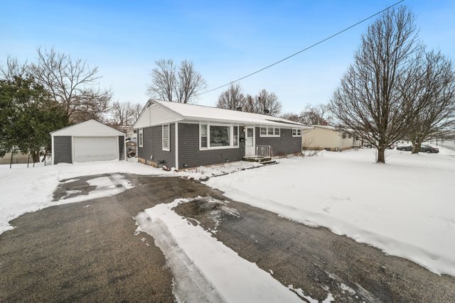 228 West Taylor Street DeKalb, IL 60115 - Photo 2 of 30 a view of house with a yard covered in snow