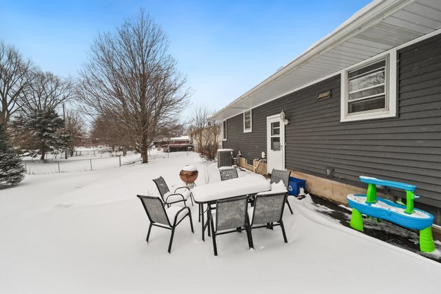 228 West Taylor Street DeKalb, IL 60115 - Photo 27 of 30 a backyard of a house with table and chairs