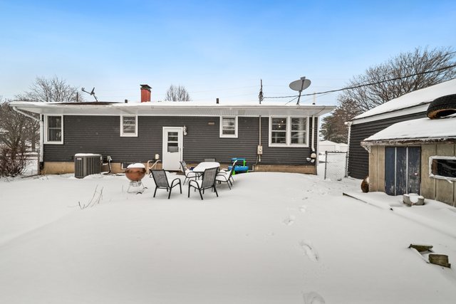 228 West Taylor Street DeKalb, IL 60115 - Photo 28 of 30 a view of a terrace with chairs and potted plants
