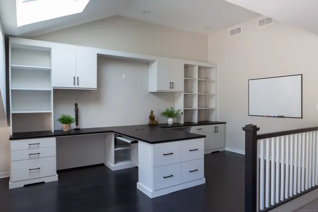 a kitchen with stainless steel appliances a sink and cabinets