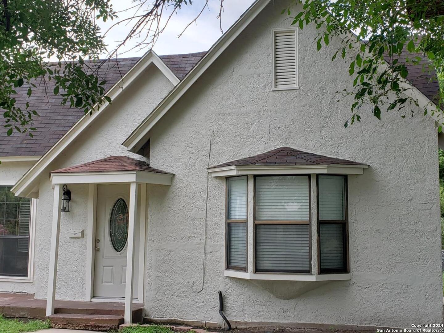 1406 Hicks Avenue San Antonio, TX 78210 - Photo 2 of 14 a front view of a house with white doors