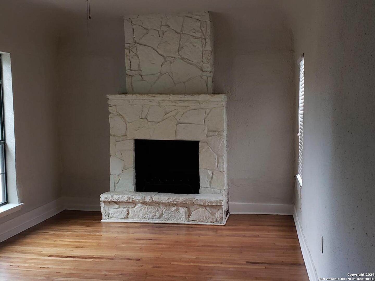 1406 Hicks Avenue San Antonio, TX 78210 - Photo 7 of 14 a living room with a fireplace