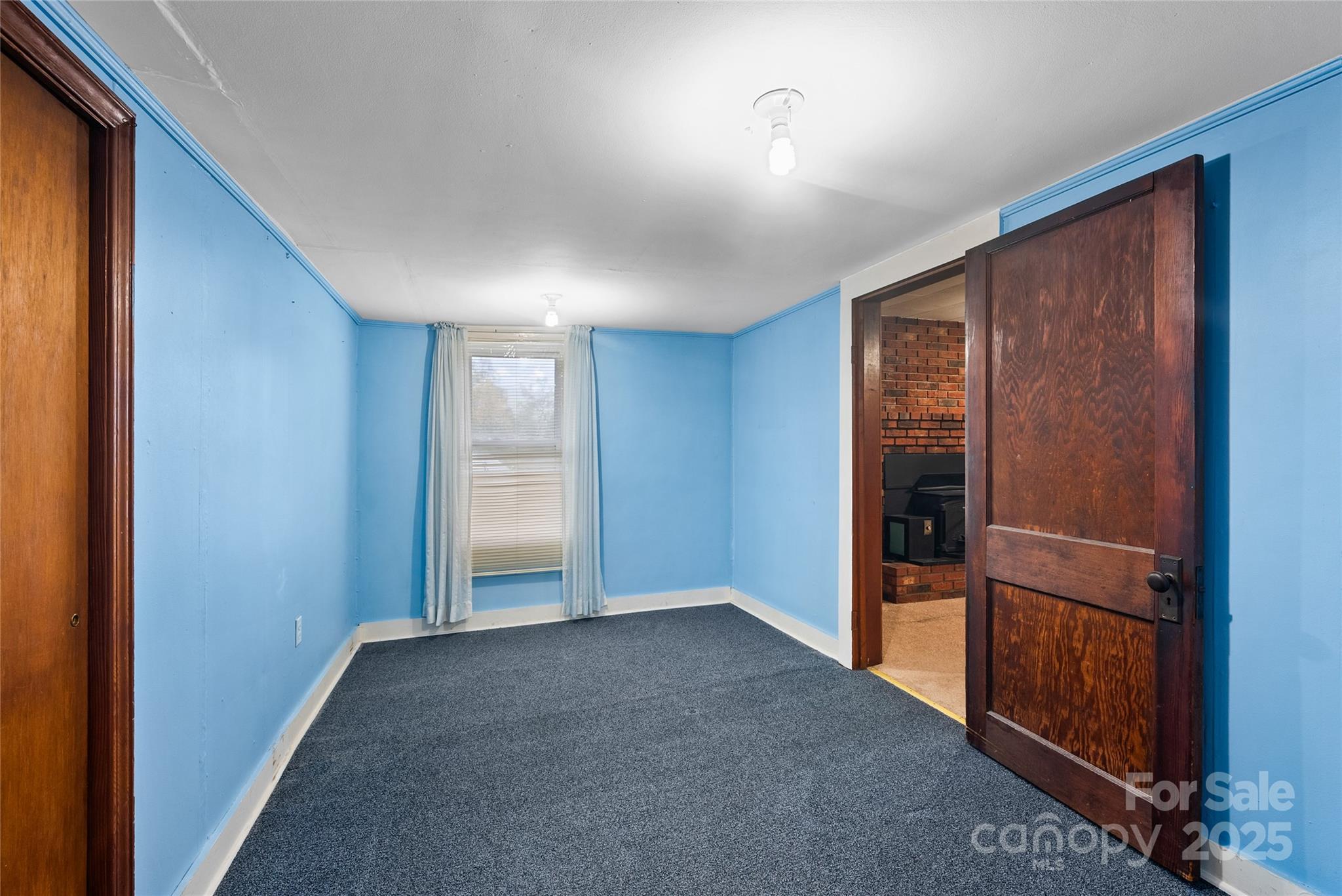 841 Elm Bend Road Brevard, NC 28712 - Photo 14 of 26 an empty room with closet and windows