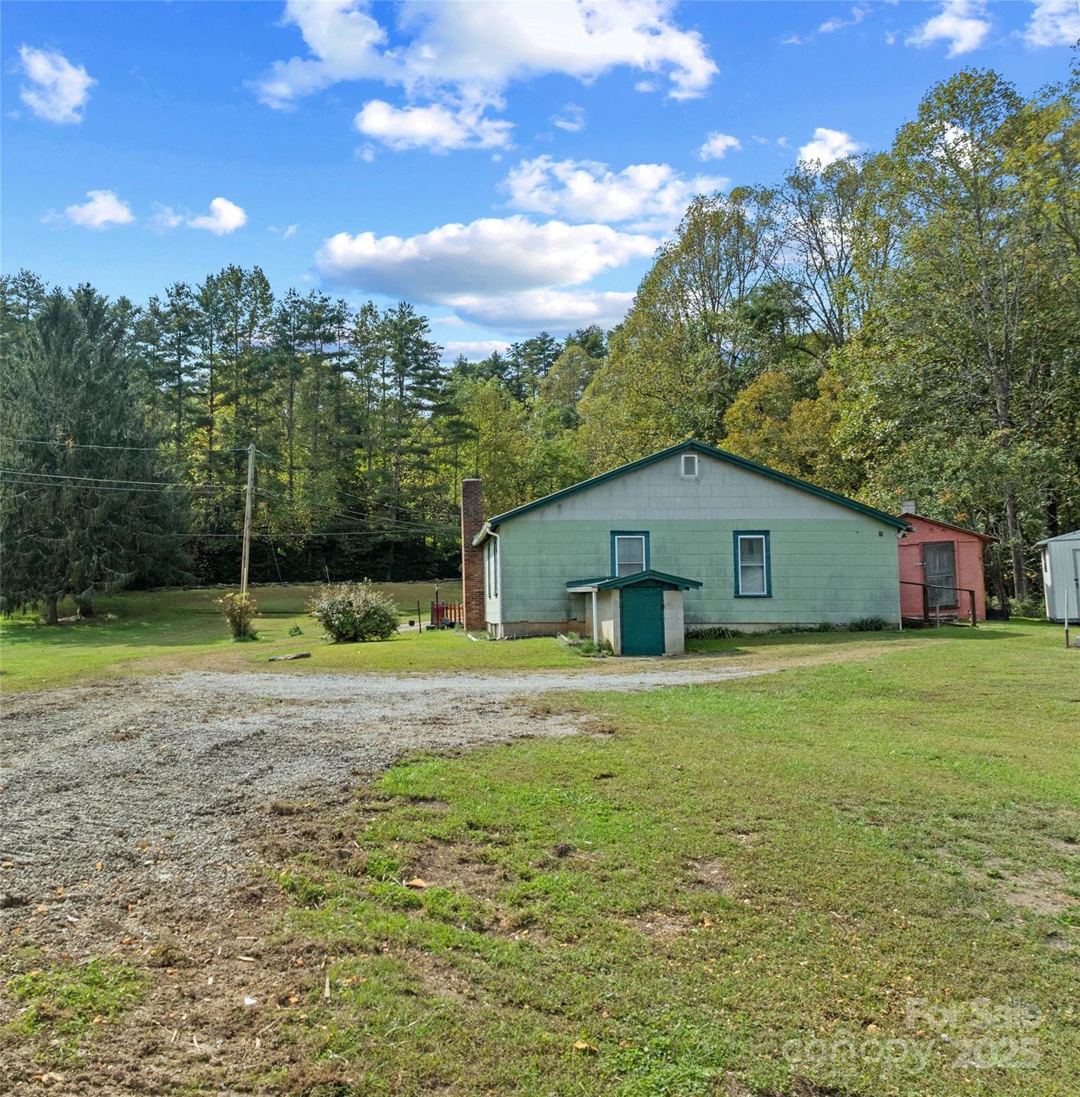 841 Elm Bend Road Brevard, NC 28712 - Photo 18 of 26 a view of a house with a backyard
