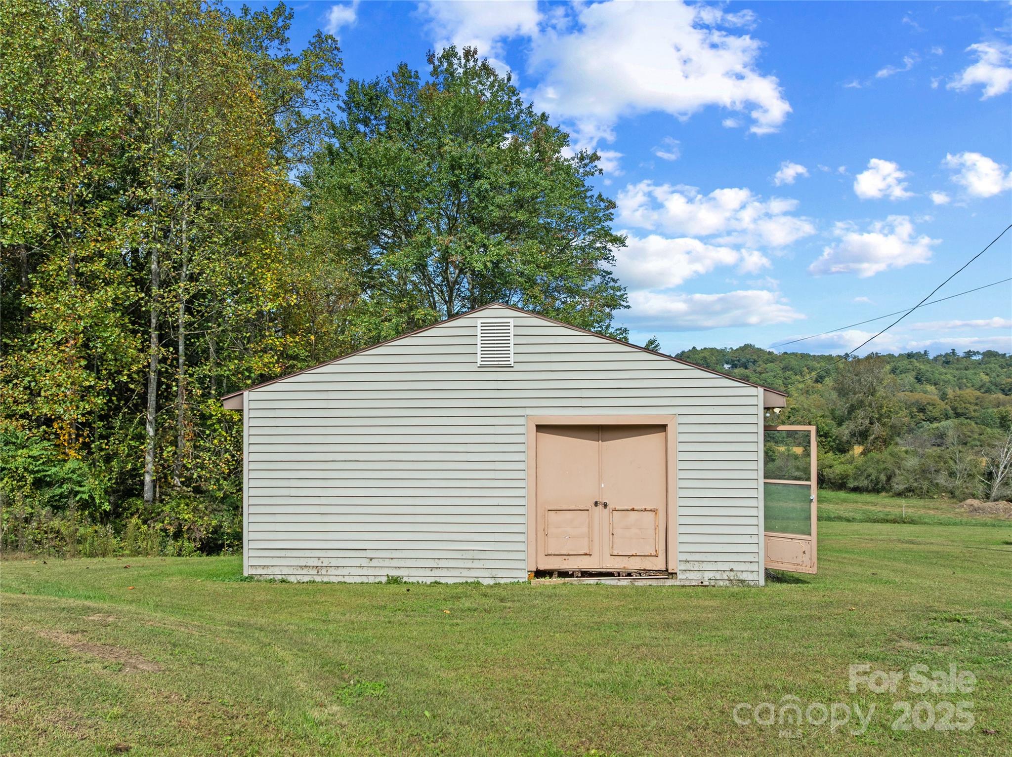 841 Elm Bend Road Brevard, NC 28712 - Photo 20 of 26 a front view of a house with a garden