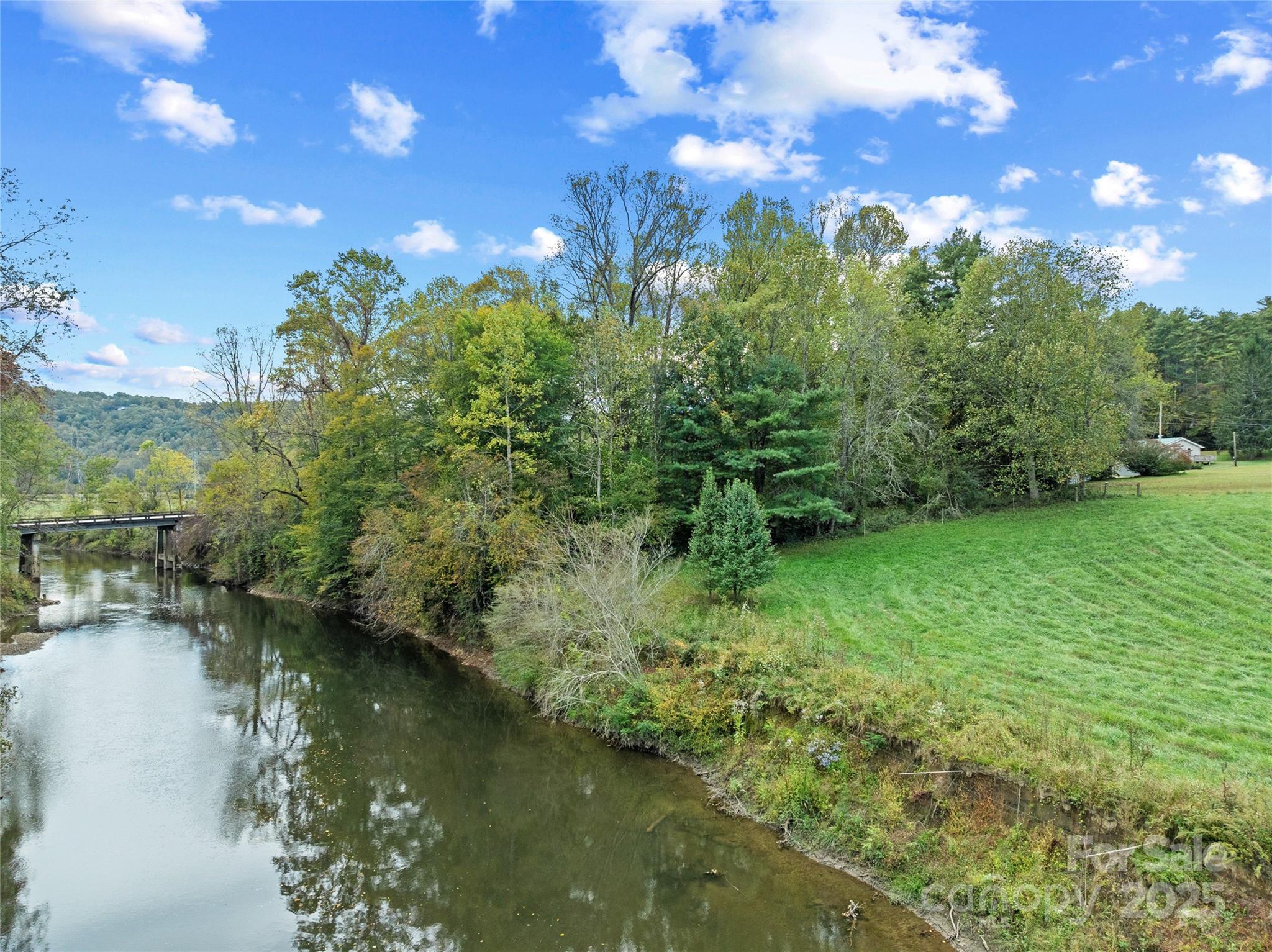 841 Elm Bend Road Brevard, NC 28712 - Photo 2 of 26 a view of a lake with a yard