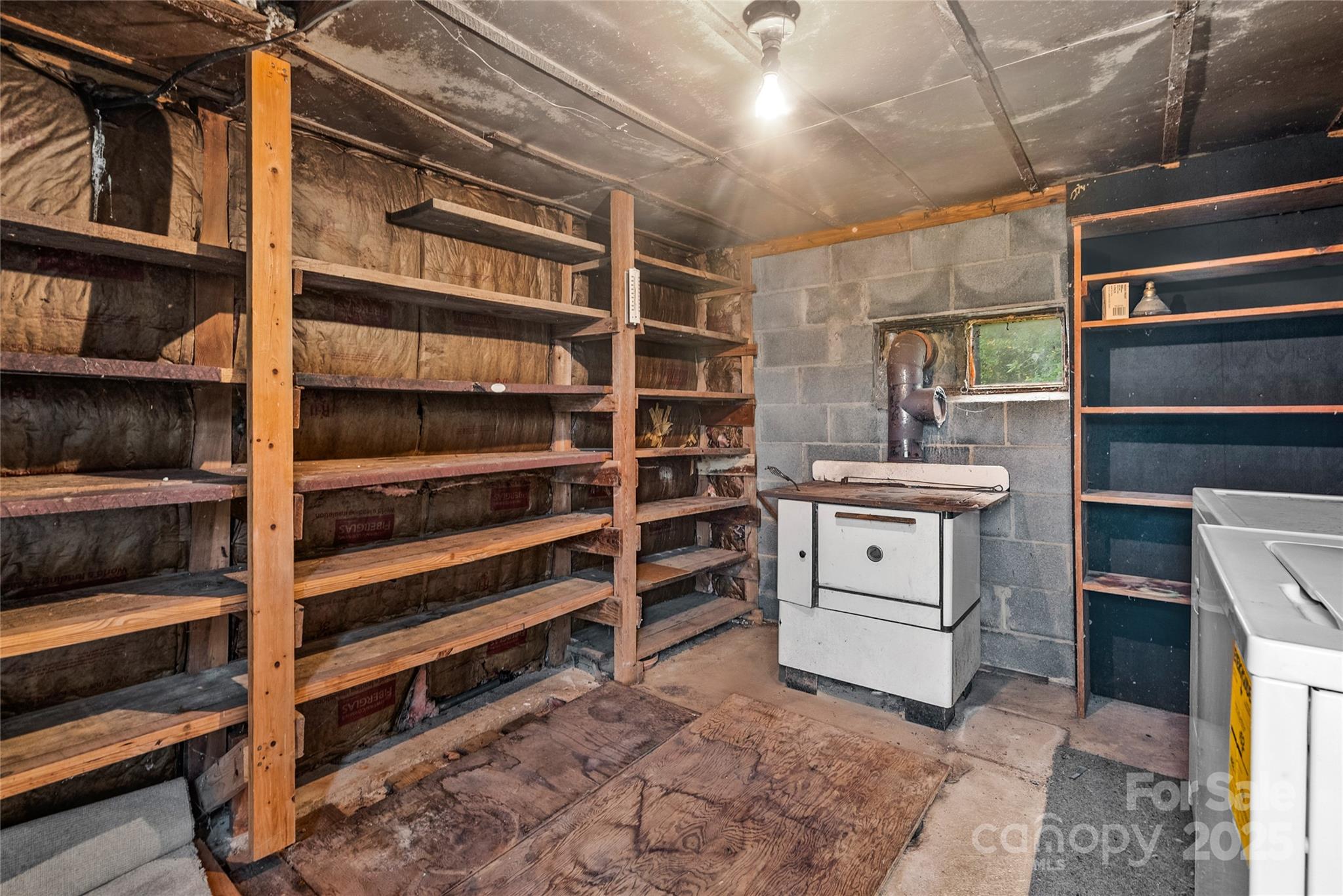 841 Elm Bend Road Brevard, NC 28712 - Photo 23 of 26 a view of walk in closet with empty racks
