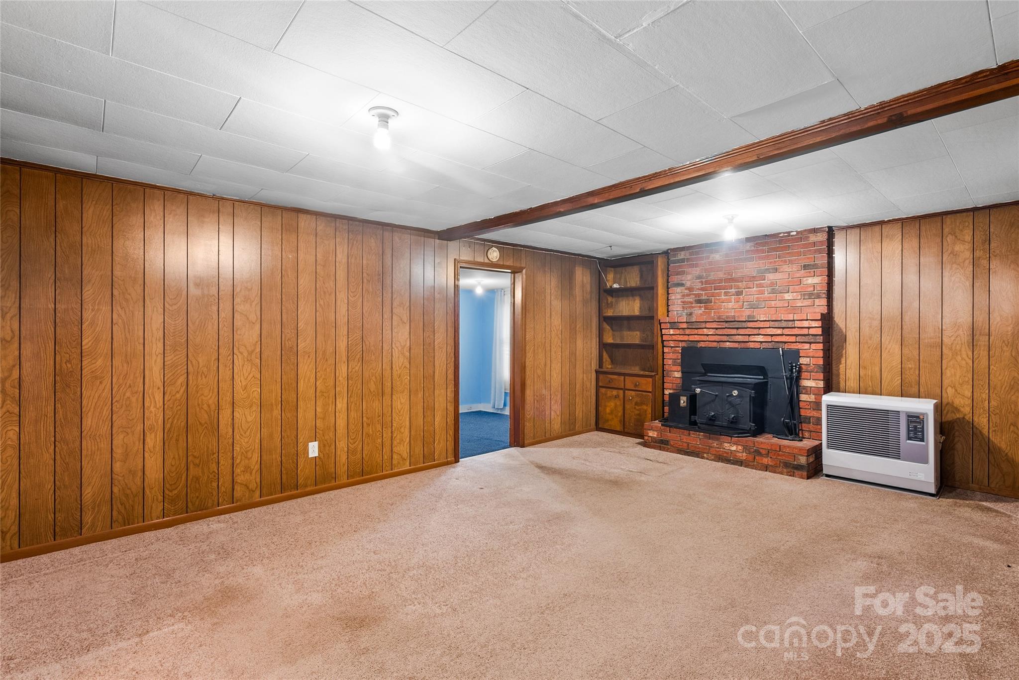 841 Elm Bend Road Brevard, NC 28712 - Photo 9 of 26 a view of an empty room with a fireplace