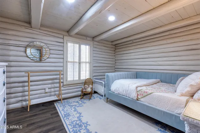 a bedroom with a bed and a dresser