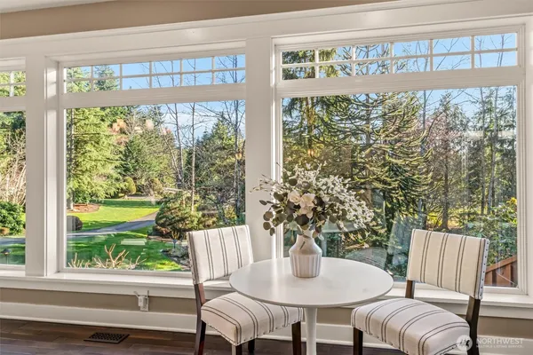 a outdoor dining room with furniture and window