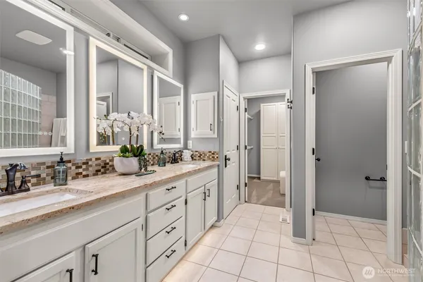 a spacious bathroom with a shower and a sink