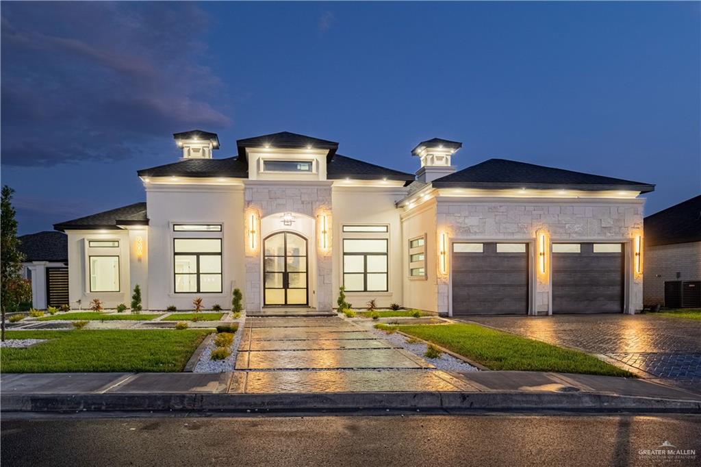 a view of a big building with big yard and large tree