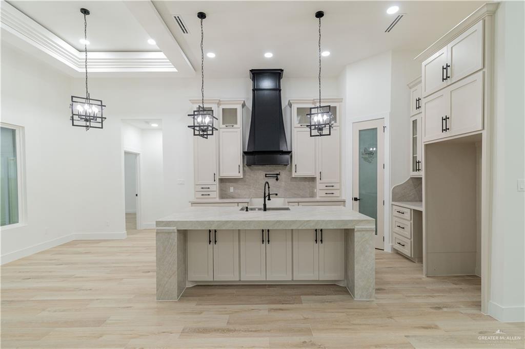 9804 North 25th Street McAllen, TX 78504 - Photo 6 of 18 a bathroom with a sink a toilet a large mirror and shower