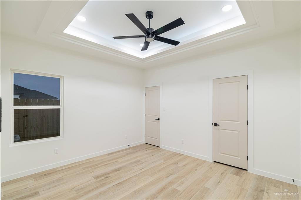 9804 North 25th Street McAllen, TX 78504 - Photo 10 of 18 an empty room with closet and windows
