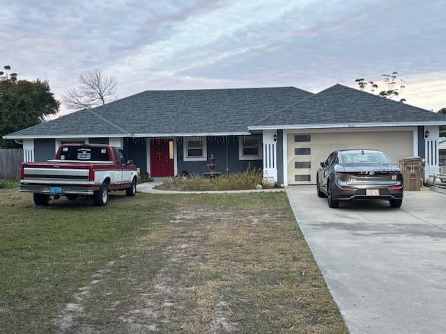 a house view with a car parked in front of it