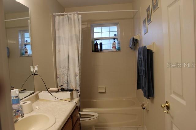 34321 South Haines Creek Road Leesburg, FL 34788 - Photo 14 of 19 a bathroom with a sink toilet and shower