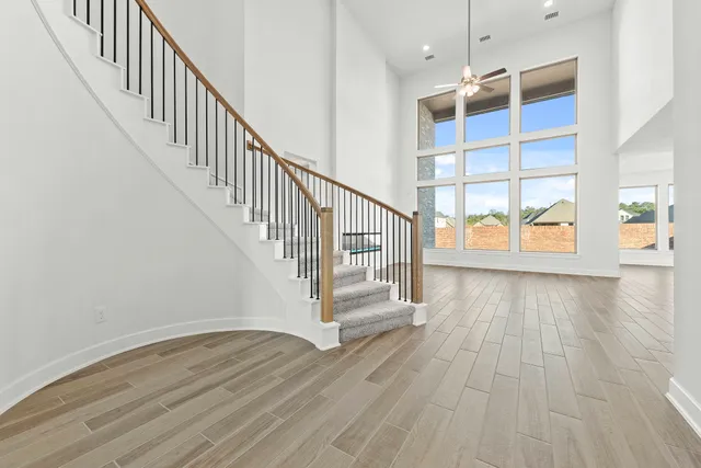 a view of an entryway with wooden floor