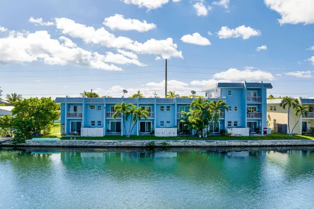 a view of a lake with a house in the background