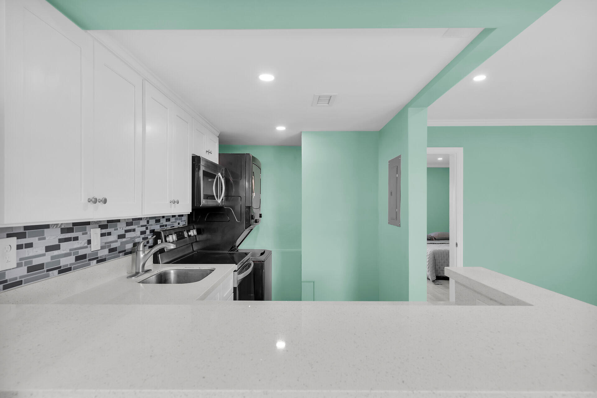 201 Coppitt Road, Unit 202C Key West, FL 33040 - Photo 11 of 31 a bathroom with a sink a toilet and mirror