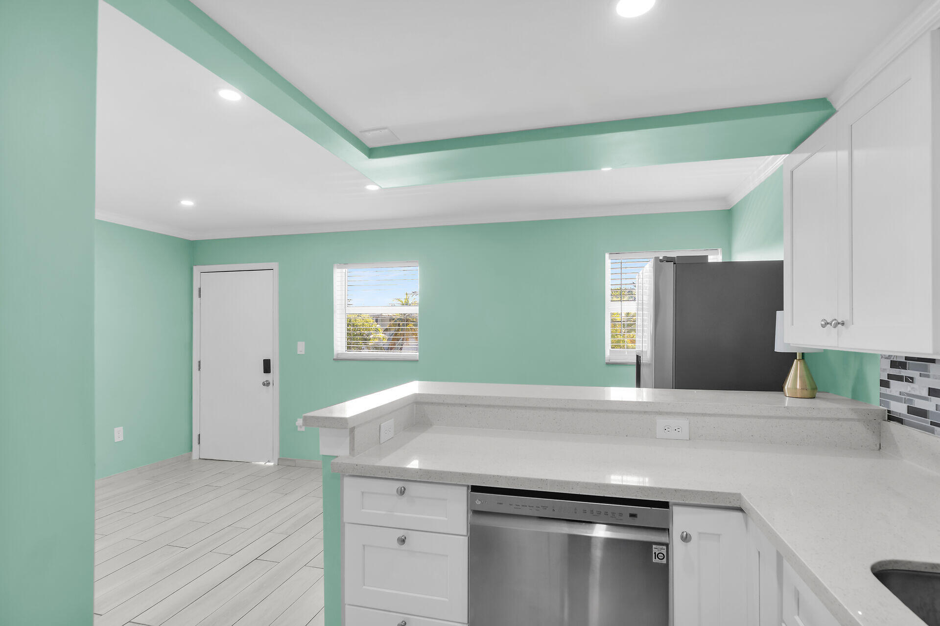 201 Coppitt Road, Unit 202C Key West, FL 33040 - Photo 12 of 31 a kitchen with a stove and a refrigerator