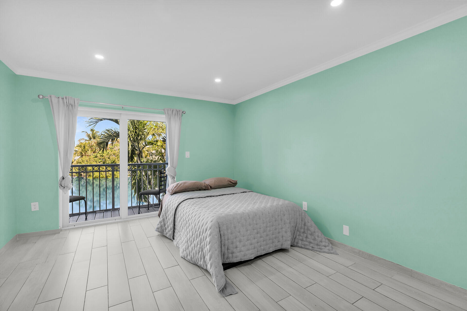 201 Coppitt Road, Unit 202C Key West, FL 33040 - Photo 13 of 31 a bedroom with a bed and a large window