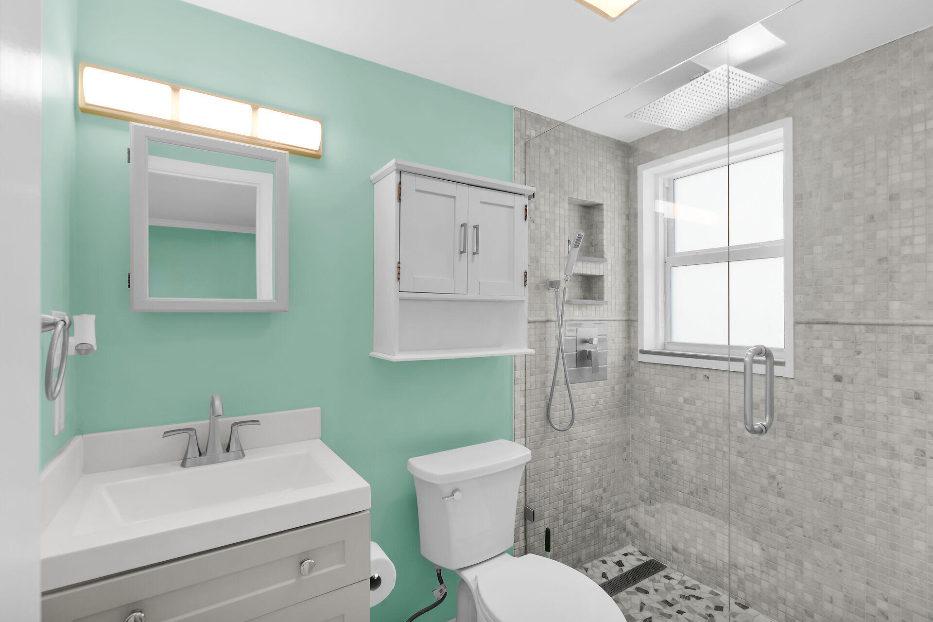 201 Coppitt Road, Unit 202C Key West, FL 33040 - Photo 17 of 31 a bathroom with a sink toilet and shower