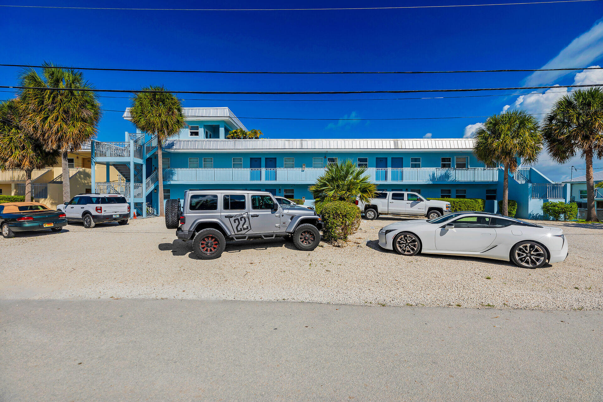 201 Coppitt Road, Unit 202C Key West, FL 33040 - Photo 2 of 31 a front view of a house with parking space