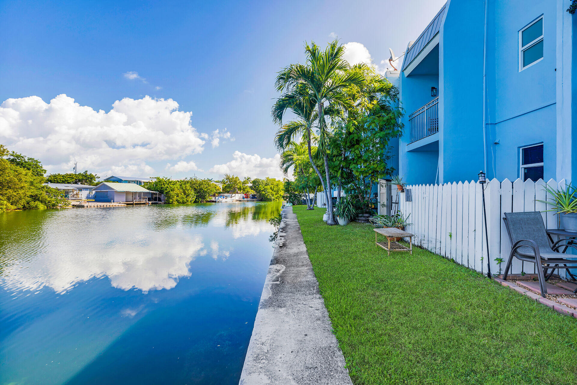 201 Coppitt Road, Unit 202C Key West, FL 33040 - Photo 23 of 31 a view of a lake with a big yard