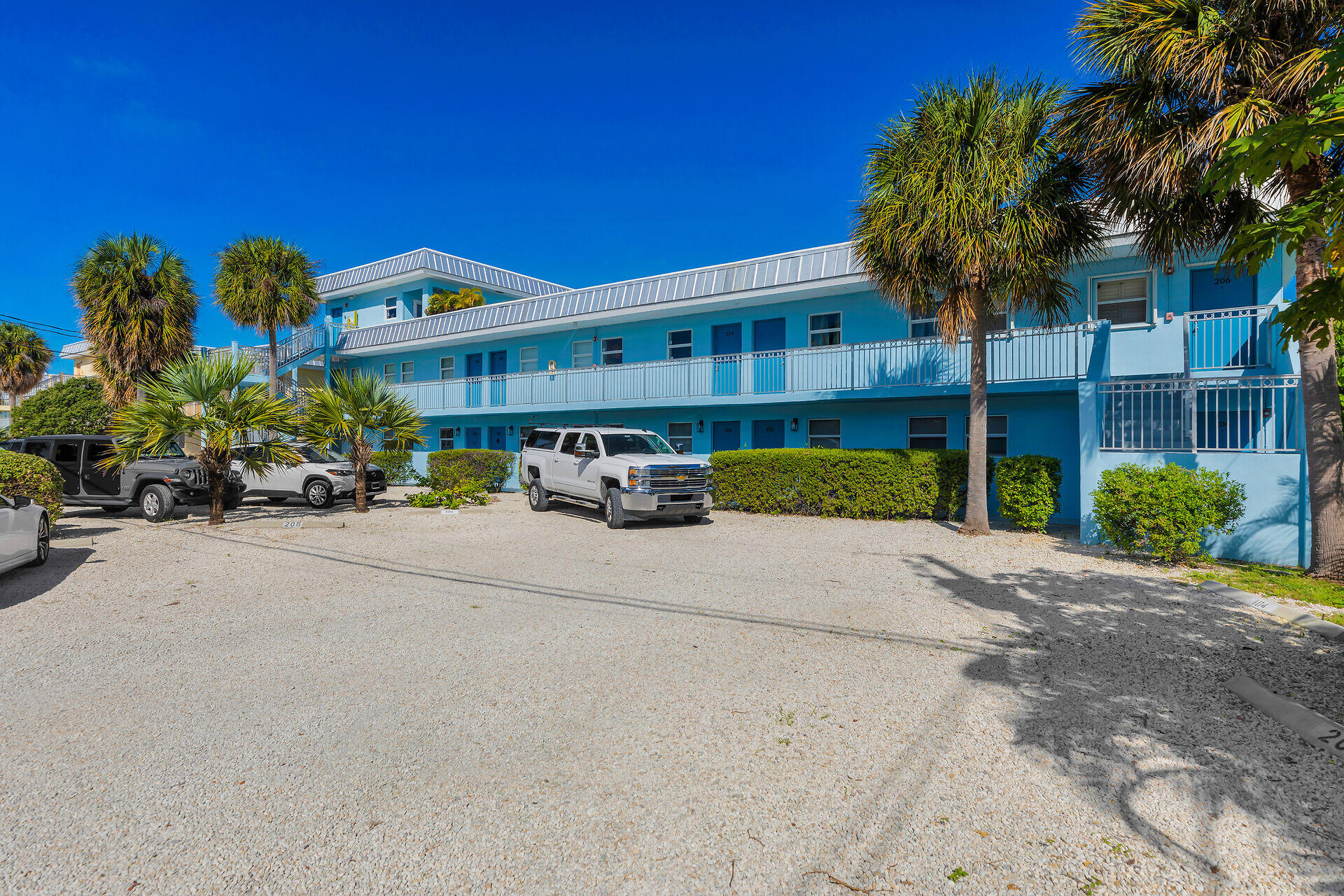 201 Coppitt Road, Unit 202C Key West, FL 33040 - Photo 3 of 31 a couple of cars parked in front of a building