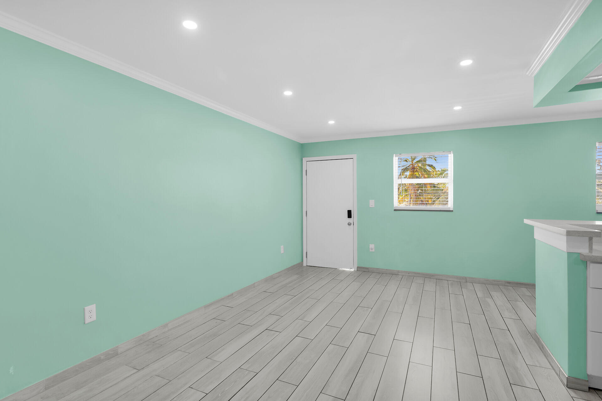 201 Coppitt Road, Unit 202C Key West, FL 33040 - Photo 8 of 31 a view of room with window and wooden floor