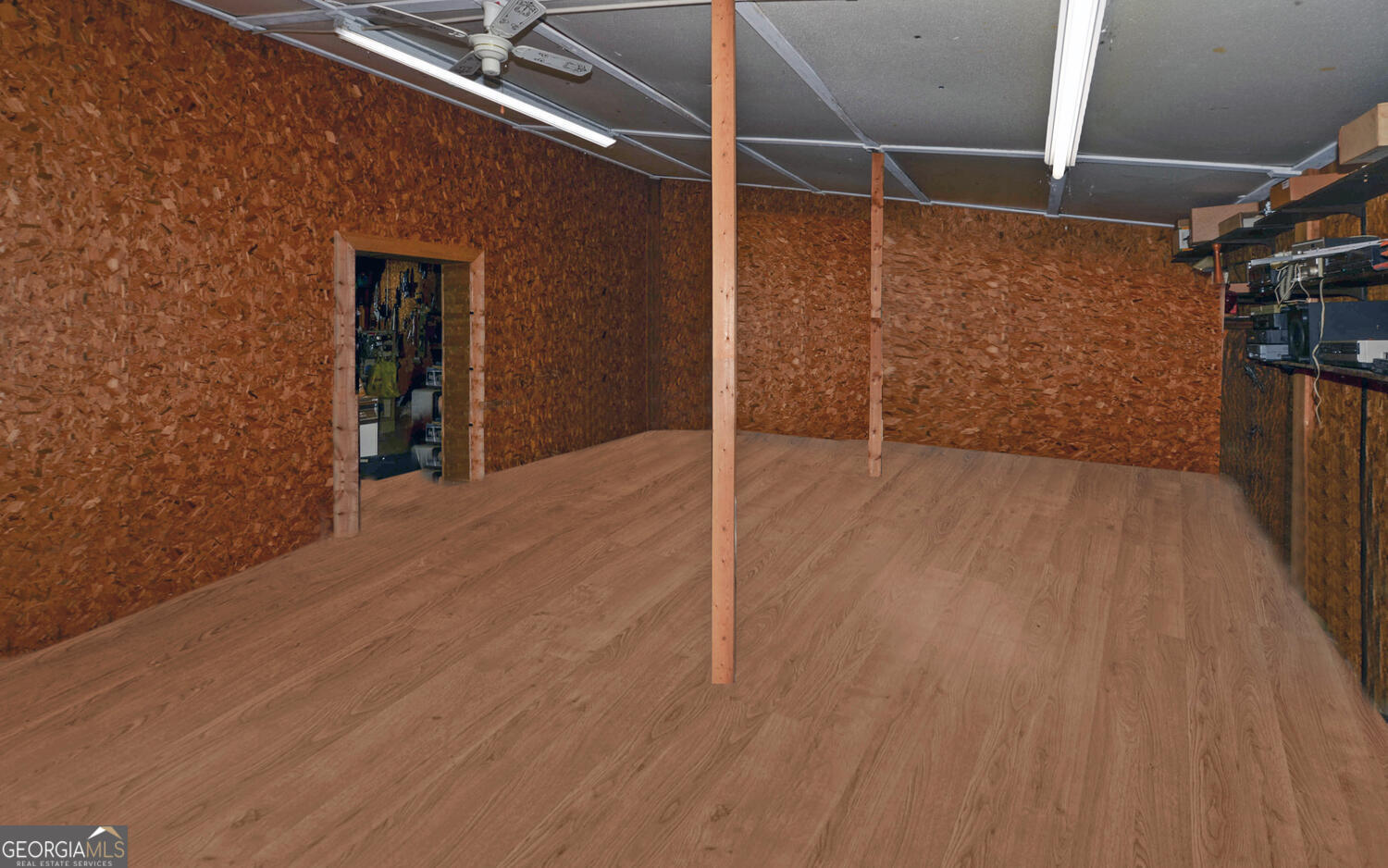 790 Collins Road Toccoa, GA 30577 - Photo 17 of 36 a view of an empty room with wooden floor