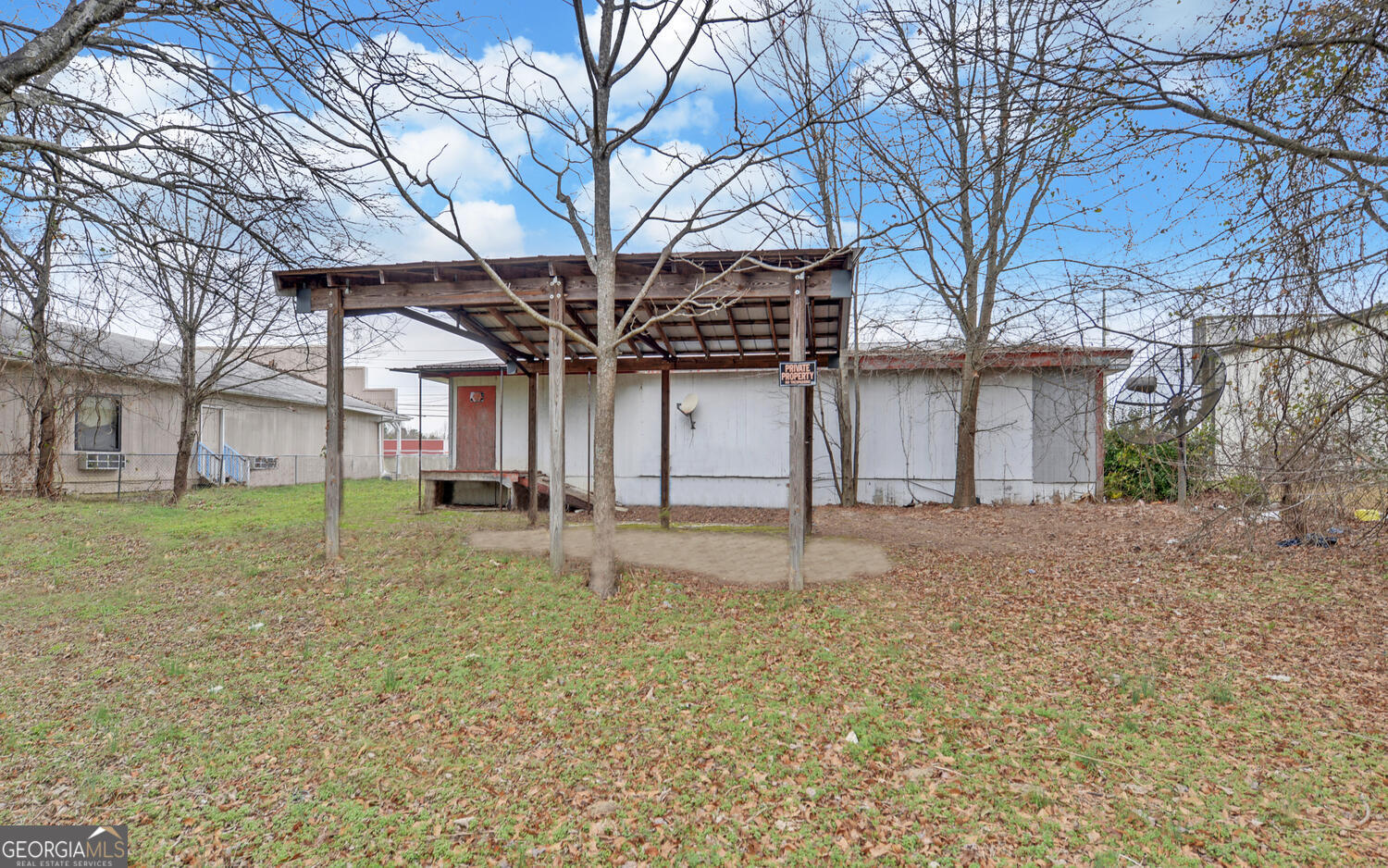 790 Collins Road Toccoa, GA 30577 - Photo 22 of 36 a view of a house with a yard and large tree