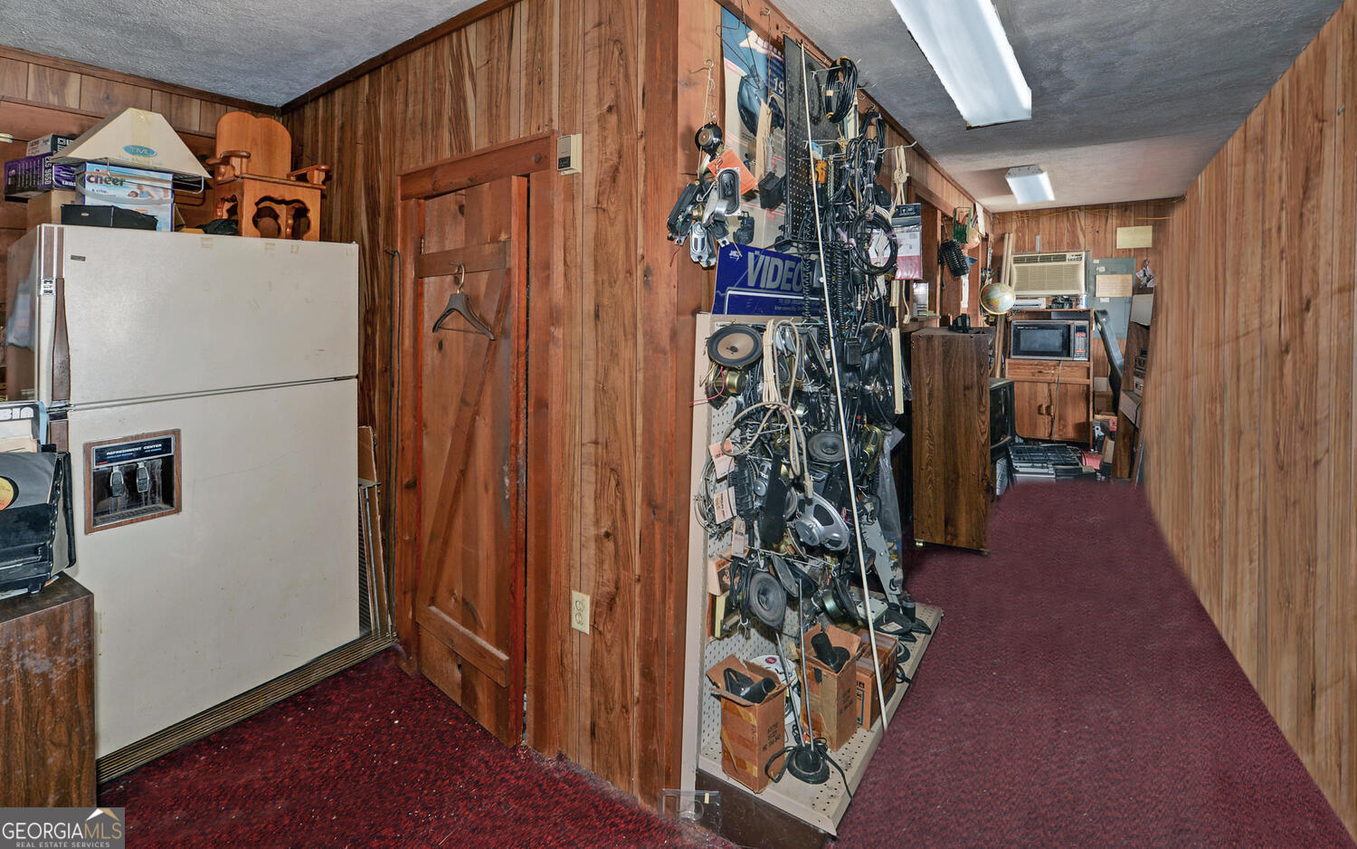 790 Collins Road Toccoa, GA 30577 - Photo 10 of 36 a view of a hallway with wooden floor and stairs