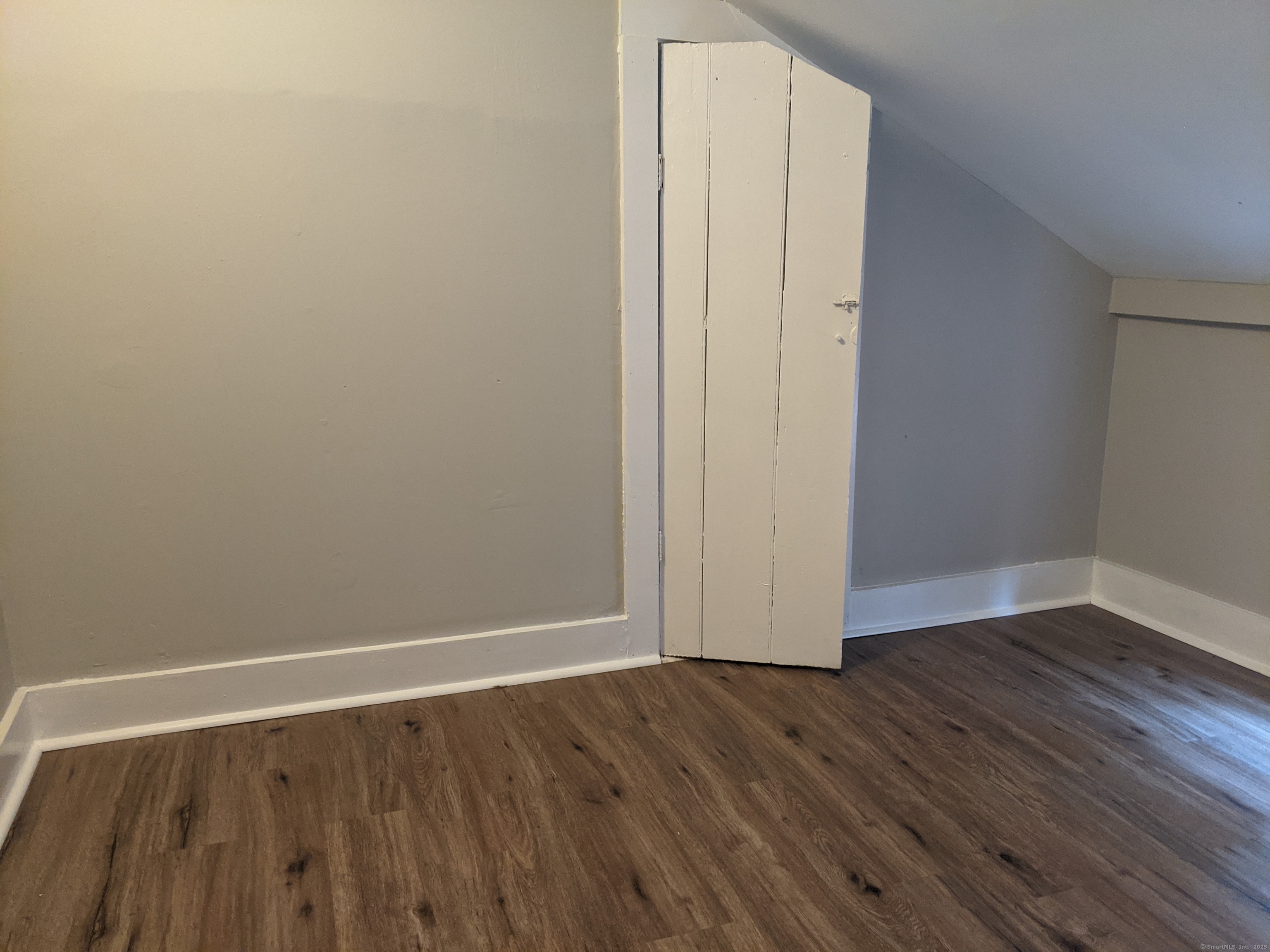 98 Water Street Derby, CT 06418 - Photo 14 of 15 a view of an empty room with wooden floor