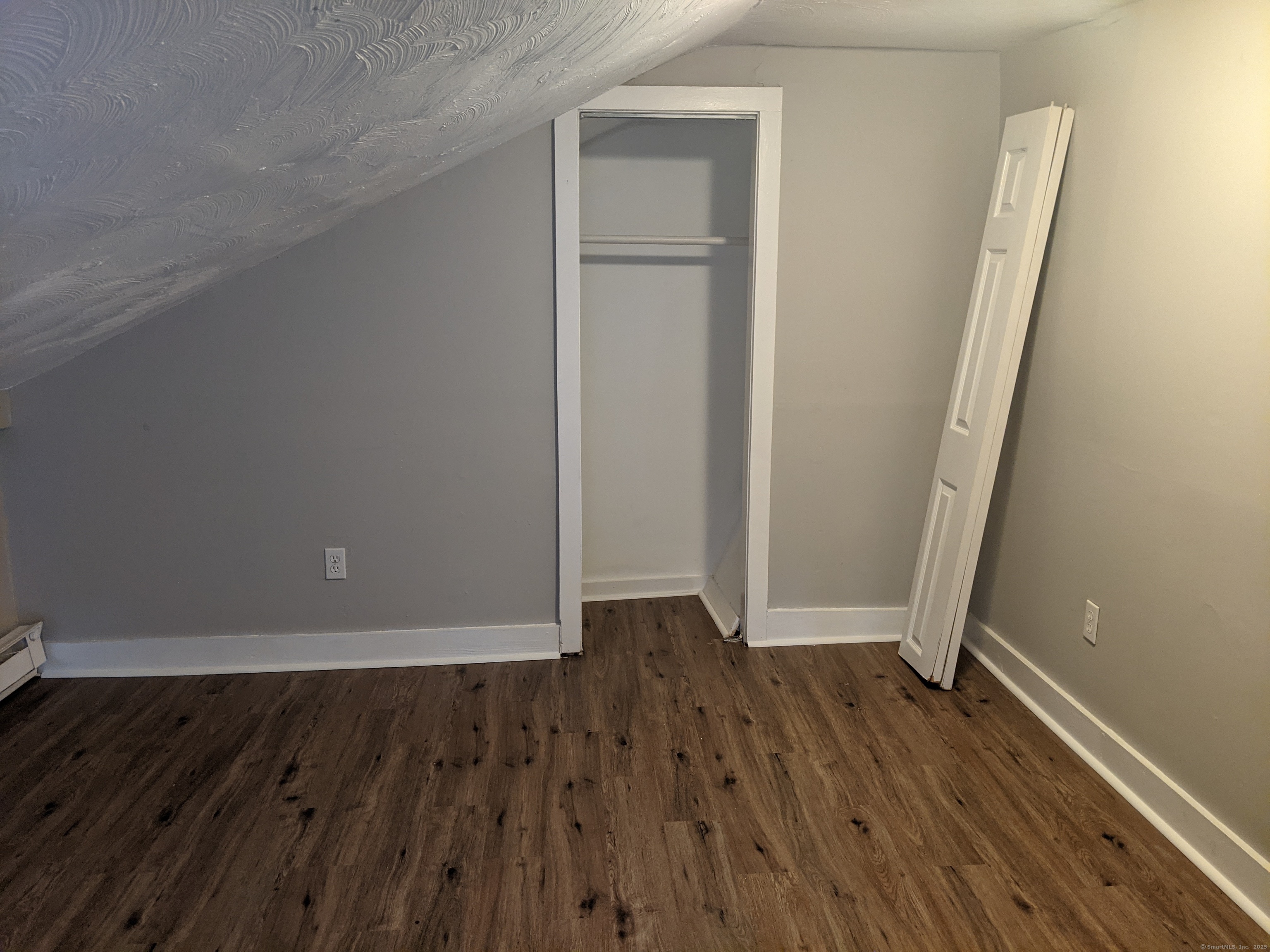 98 Water Street Derby, CT 06418 - Photo 15 of 15 an empty room with wooden floor and entrance