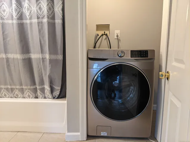 a utility room with dryer and washer