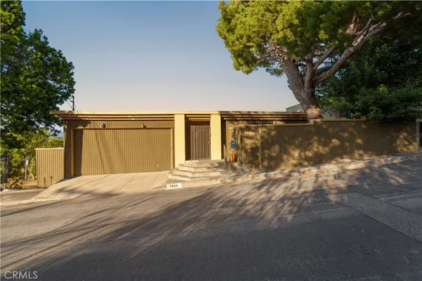 a view of a house with a yard and garage
