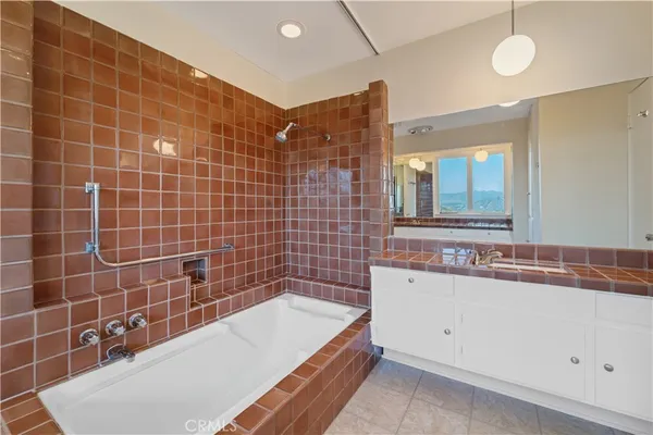 a bathroom with a bathtub and a sink