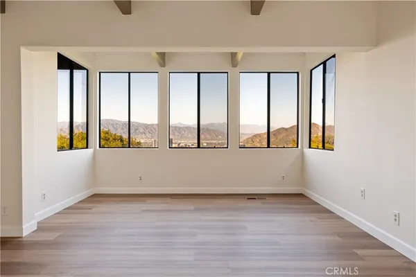 wooden floor and window in an empty room