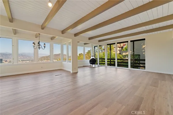 a view of a livingroom with wooden floor